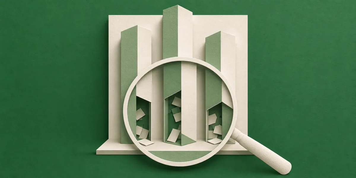 A paper bar chart under a magnifying glass, which shows the bars are hollow and loosely packed with scraps.